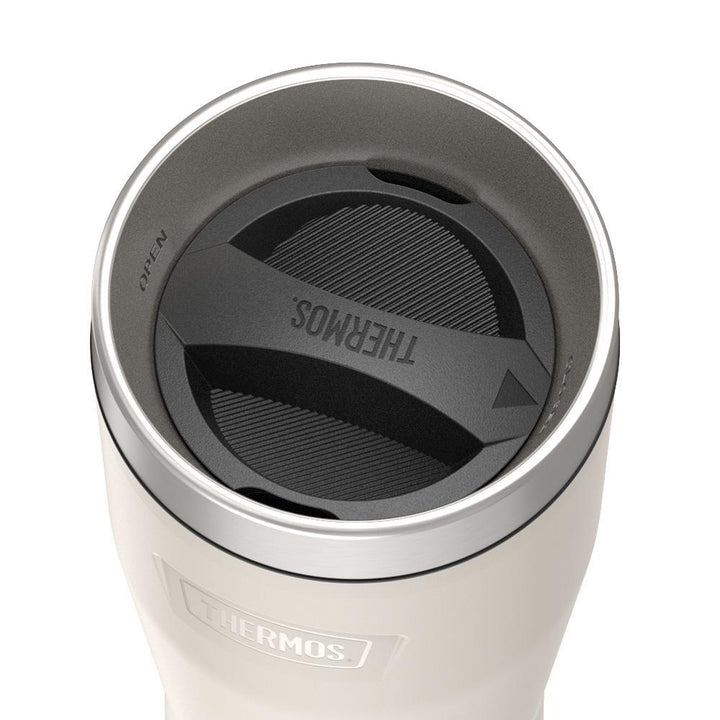 Thermos 16 ounce Stainless Steel Tumbler with twist lock lid, top view of twist lid, with arrow pointing to closed, Sandstone Beige.