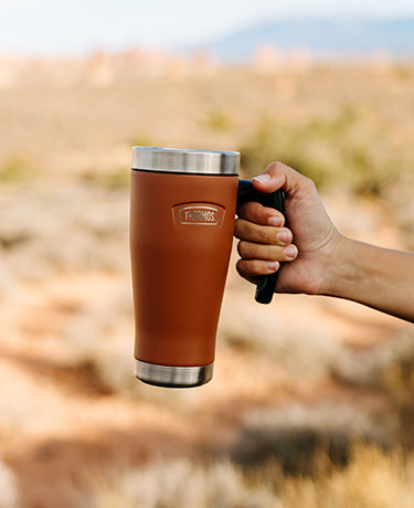 Thermos mug with handle.