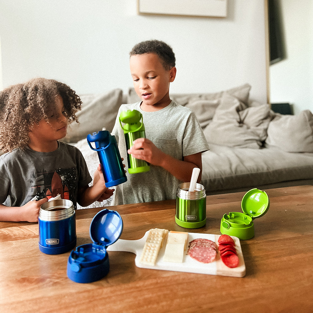 Two boys with Thermos Funtainer water bottles and food jars.