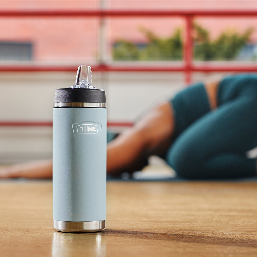 Thermos 18 ounce Water Bottle with Straw Lid in a yoga studio.