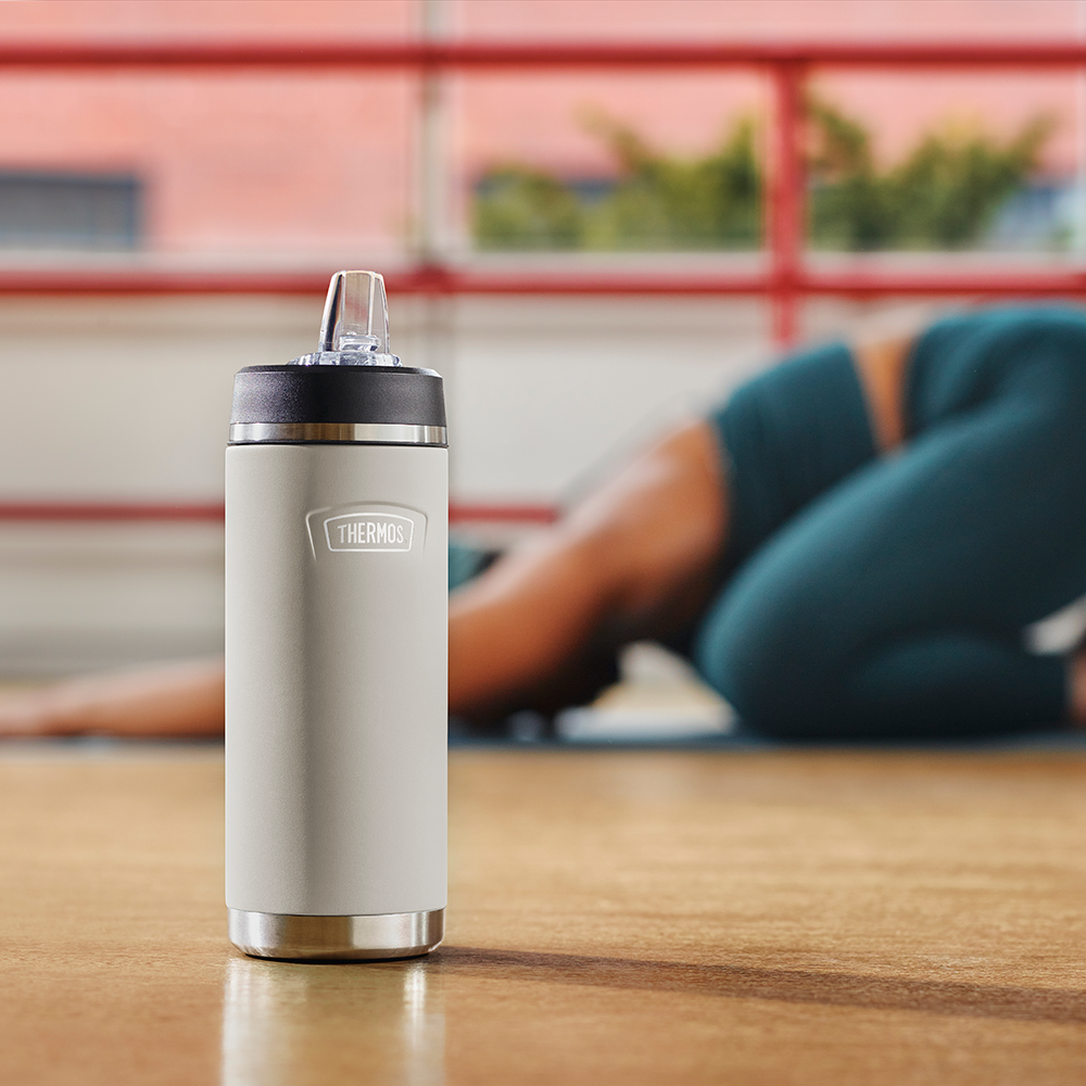 Thermos 18 ounce straw bottle in a yoga studio.